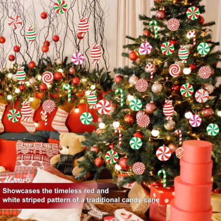 A cluster of red, white, and green striped wooden candy cane ornaments hanging from a Christmas tree branch.