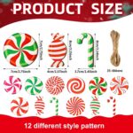 A cluster of red, white, and green striped wooden candy cane ornaments hanging from a Christmas tree branch.