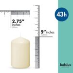 A set of 12 ivory BOLSIUS pillar candles, each 2.7x5 inches, standing upright, ready for use as elegant decor.