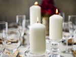A set of 12 ivory BOLSIUS pillar candles, each 2.7x5 inches, standing upright, ready for use as elegant decor.