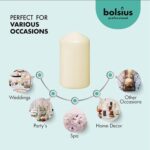 A set of 12 ivory BOLSIUS pillar candles, each 2.7x5 inches, standing upright, ready for use as elegant decor.