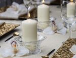 A set of 12 ivory BOLSIUS pillar candles, each 2.7x5 inches, standing upright, ready for use as elegant decor.