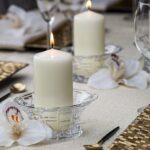 A set of 12 ivory BOLSIUS pillar candles, each 2.7x5 inches, standing upright, ready for use as elegant decor.