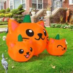A 5-foot long Halloween inflatable featuring three orange and green pumpkin cat heads with bright white LED lights, set up ou