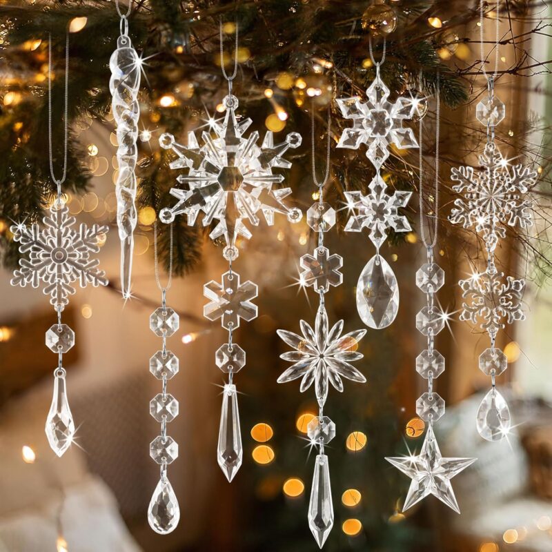 A collection of 20 clear light blue acrylic snowflake and icicle ornaments with drop pendants, ready to hang.