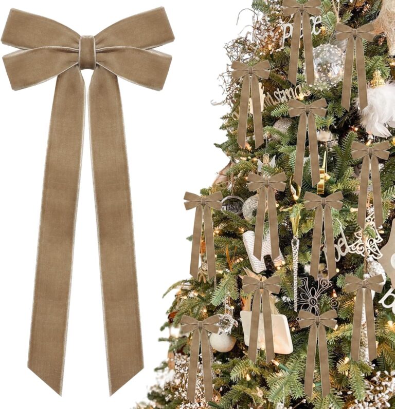 A close-up view of multiple light brown velvet ribbon bows, some hanging on a Christmas tree with soft, blurred lights in the