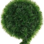 A long, lush green tinsel Christmas garland, non-lit, draped over a mantelpiece with a fireplace below.