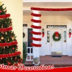 A long, vibrant red tinsel garland twisted and draped over a fireplace mantle with other Christmas decorations.