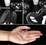 A group of ten clear plastic heart-shaped ornaments, some open to show their fillable design, ready for crafting.