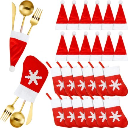 Close-up of red and white non-woven Christmas mini Santa hats and stocking silverware holders on a holiday table.