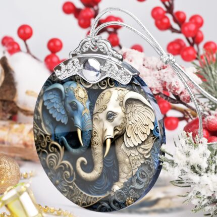 A close-up of a Touber elephant stained glass Christmas ornament hanging from a tree branch, showcasing its vibrant colors.