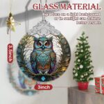 A close-up of a Touber stained glass owl Christmas ornament with intricate details and vibrant colors, hanging by a ribbon.