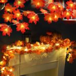 Two strands of TURNMEON fall garlands, each with 40 enlarged orange and yellow maple leaves and warm white LED lights, draped
