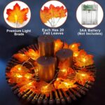 Two strands of TURNMEON fall garlands, each with 40 enlarged orange and yellow maple leaves and warm white LED lights, draped
