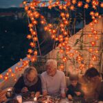 Two strands of TURNMEON fall garlands, each with 40 enlarged orange and yellow maple leaves and warm white LED lights, draped
