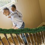 Two rolls of Wewymewo 50-foot green artificial Christmas garlands with bendable wire, suitable for indoor and outdoor holiday